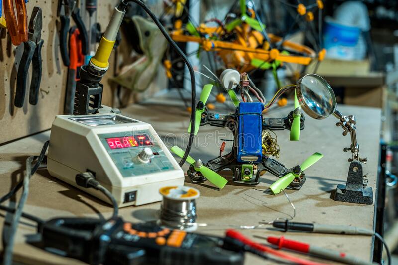 working-industrial-electronics-workshop-drones-repairing-testing-equipment-209122894 working-industrial-electronics-workshop-drones-repairing-testing-equipment-209122894